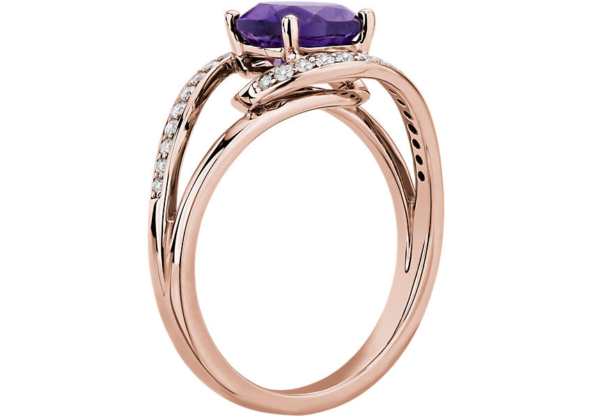 A side profile view of an ornate twisted engagement ring setting with amethyst centre and diamond pavé