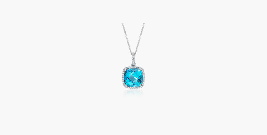 A well-cut swiss blue topaz gemstone pendant showcasing symmetrical facets