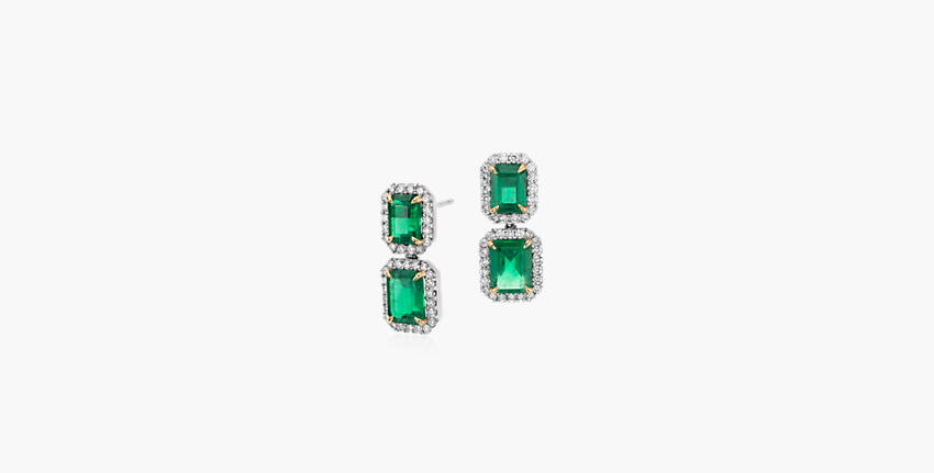 Emerald earrings demonstrating the gemstone's unique inclusions called jardin