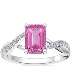 Anillo de compromiso clásico de diseño torcido con halo de diamantes pequeños y zafiro de talla esmeralda de color rosado en oro blanco de 18 k (7x5 mm)