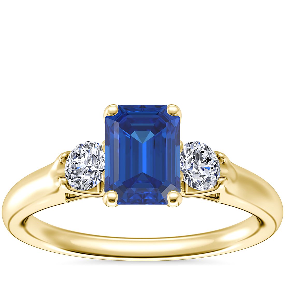 Classic Three Stone Engagement Ring with Emerald-Cut Sapphire in 18k Yellow Gold (7x5mm)