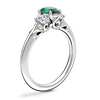 Vintage Three Stone Engagement Ring with Oval Emerald in Platinum (7x5mm)