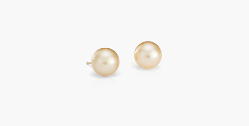 A pair of 9.4 millimetre amber-tinted Golden South Sea cultured pearl stud earrings with yellow gold posts