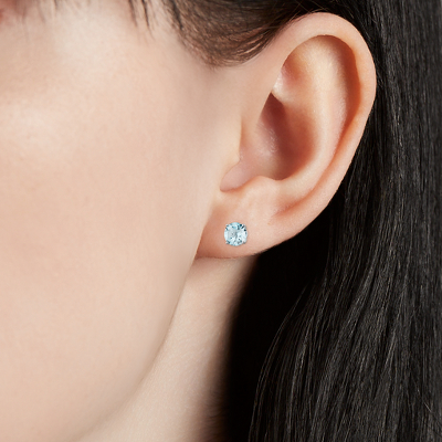 Closeup of earring on woman's ear