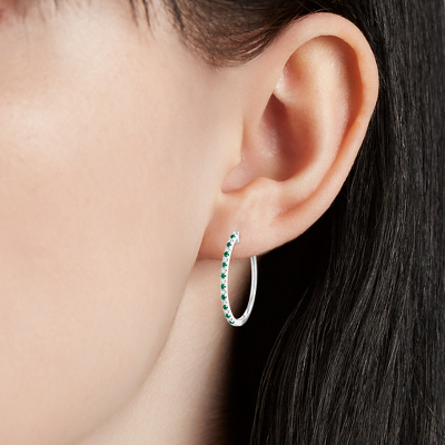 Closeup of earring on woman's ear