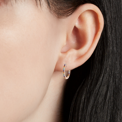 Closeup of earring on woman's ear