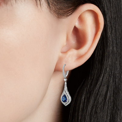 Closeup of earring on woman's ear