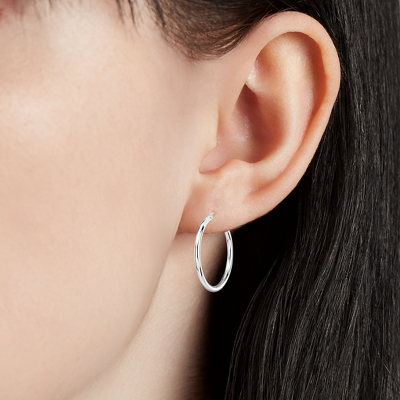Closeup of earring on woman's ear