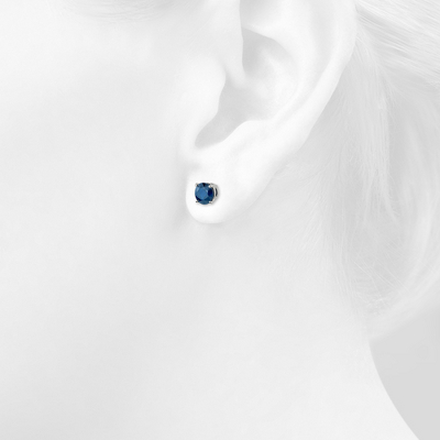 Closeup of earring on woman's ear