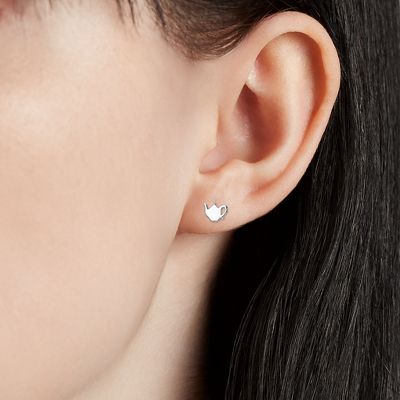 Closeup of earring on woman's ear