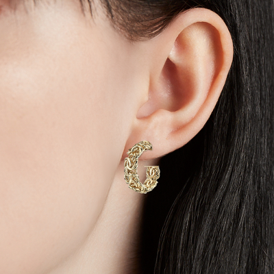 Closeup of earring on woman's ear