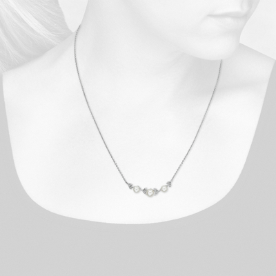 Closeup view of necklace on woman's neck