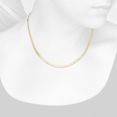 Closeup view of necklace on woman's neck