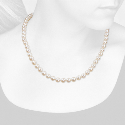 Closeup view of necklace on woman's neck