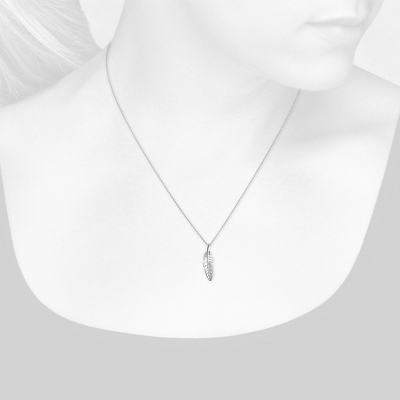 Closeup view of necklace on woman's neck