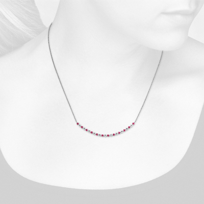 Closeup view of necklace on woman's neck