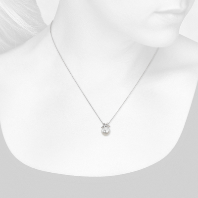 Closeup view of necklace on woman's neck