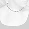 Closeup view of necklace on woman's neck