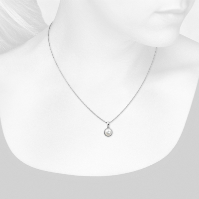 Closeup view of necklace on woman's neck
