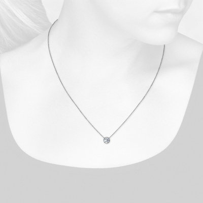 Closeup view of necklace on woman's neck