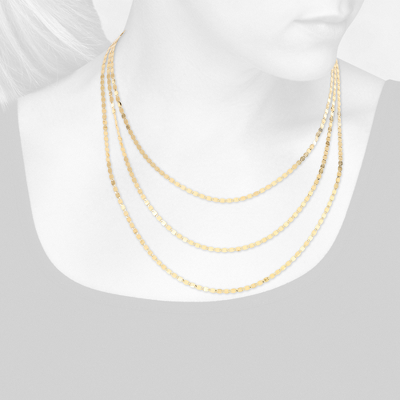 Closeup view of necklace on woman's neck