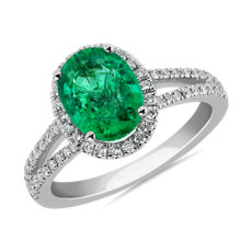 Oval Emerald and Diamond Halo Split Shank Ring in 14k White Gold (9x7mm)