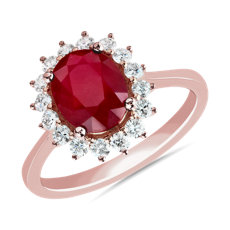 Oval Ruby and Diamond Sunburst Halo Ring in 14k Rose Gold (9x7mm)