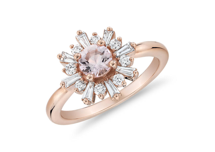 A cushion-cut morganite gemstone engagement ring accented by pavé diamonds in an infinity twist design set in rose gold