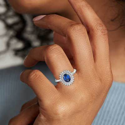 https://bnsec.bluenile.com/bluenile/is/image/bluenile/-oval-sapphire-ring-double-sunburst-diamond-halo-14k-white-gold-/70998_sidehand?$phab_detailmain$
