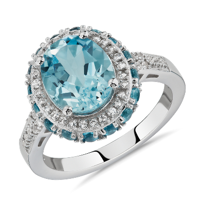 Swiss Blue Topaz And Diamond Ring - Swiss Blue Topaz and White Sapphire Ring in Sterling - Sterling silver ring with one 6 millimeter round swiss blue topaz and 26 round single cut diamonds weighing approximately 1/8 ct.