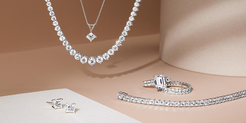 Eternity rings, eternity necklace, diamond pendant, and studs
