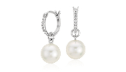 South Sea cultured pearl earrings with round diamonds framed in 18k white gold.