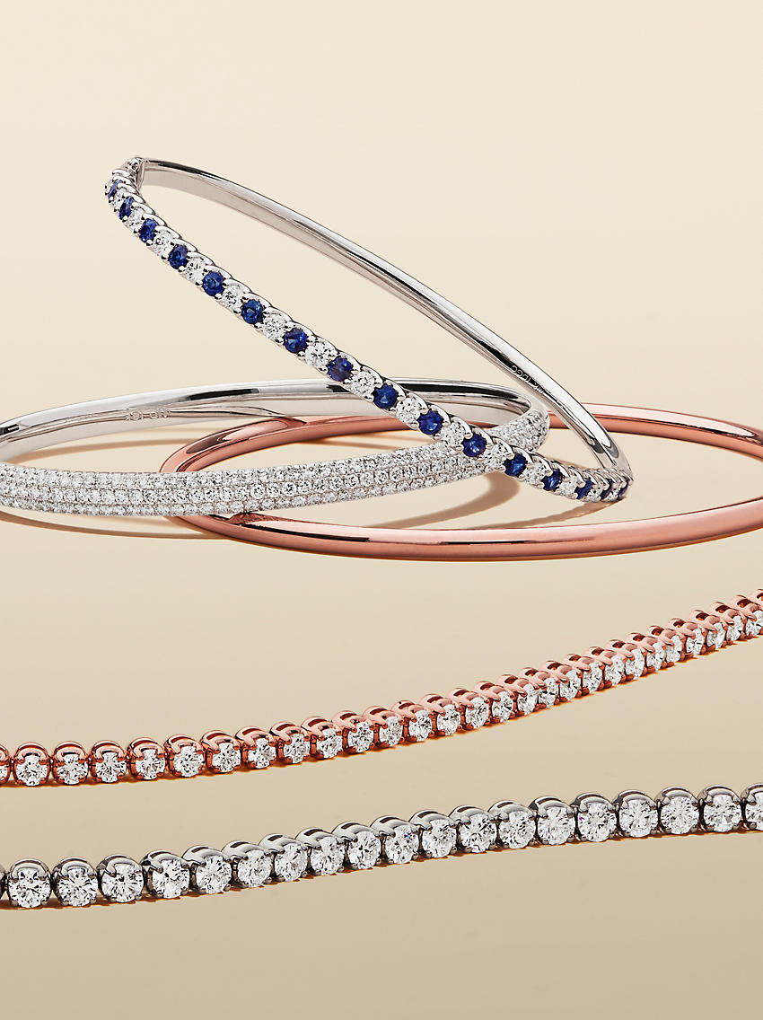 An assortment of bangles and diamond tennis bracelets