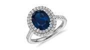 Ring featuring a sapphire centre stone surrounded by a diamond double halo in 18k white gold.