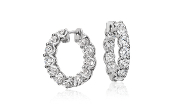 Eternity round diamond hoop earrings in 18k white gold.