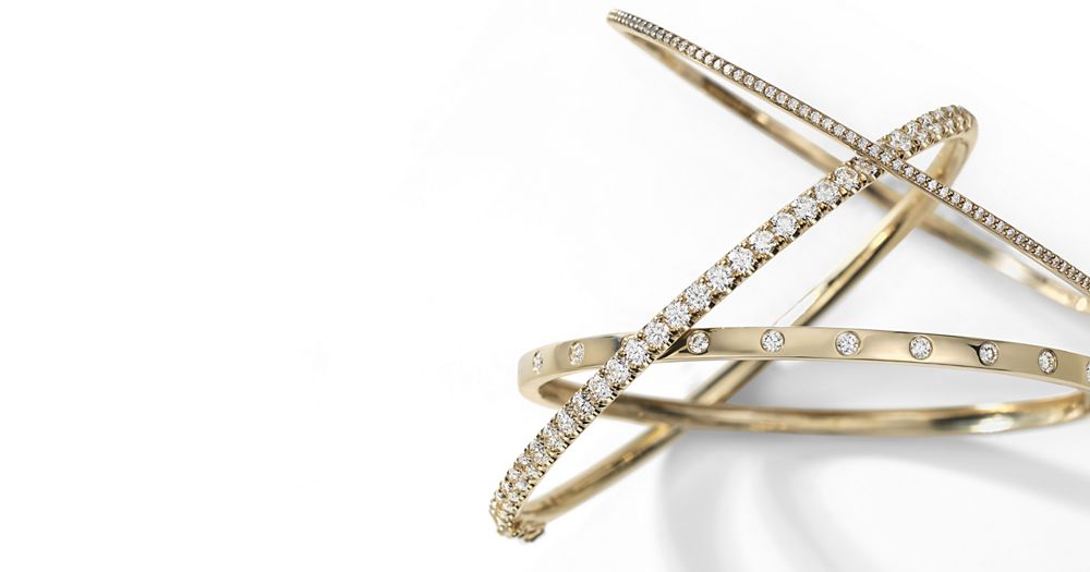 A collection of stackable diamond bangles