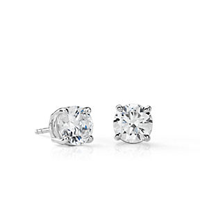 Classic four-prong diamond stud earrings in 14k white gold.