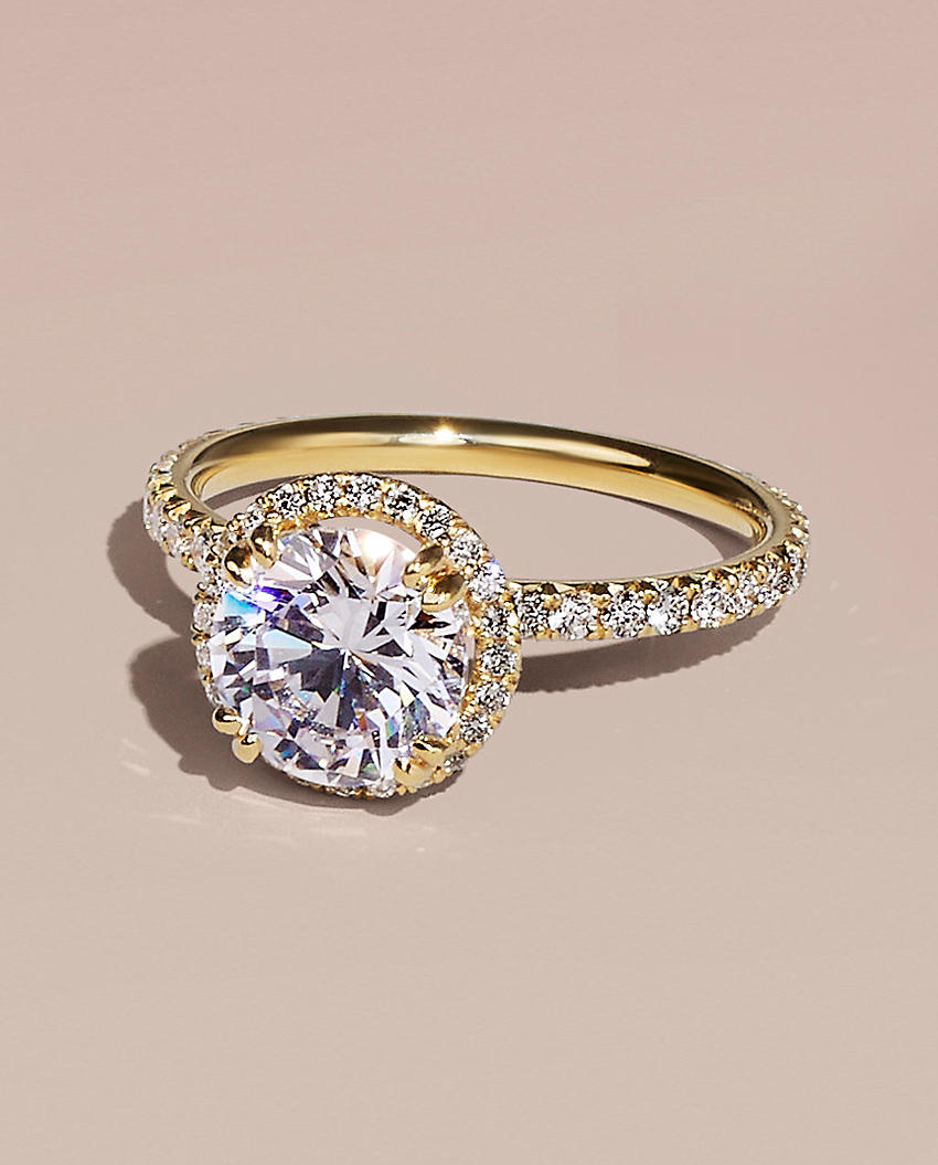 A diamond engagement ring with halo setting