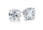Classic four-claw diamond stud earrings in 14k white gold.