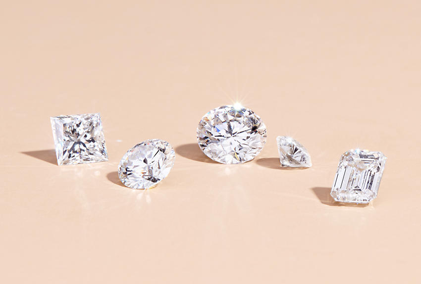 Five diamonds in different cuts and carats