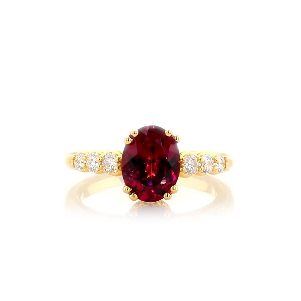 Oval Rhodolite Garnet and Diamond Side Stone Ring in 14k Yellow Gold (9x7mm)